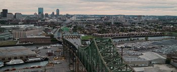 Movie still from “The Town” (2010), directed by Ben Affleck – An aerial view of a bridge and a city; Extreme Wide shot, High angle