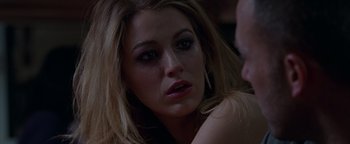 Movie still from “The Town” (2010), directed by Ben Affleck – A person sitting on the ground; Close Up shot, Over the shoulder angle