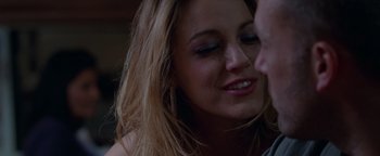 Movie still from “The Town” (2010), directed by Ben Affleck – A woman's face with a man kissing her cheek; Close Up shot, Overhead angle