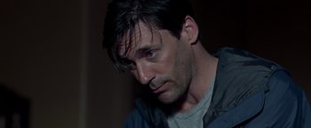 Movie still from “The Town” (2010), directed by Ben Affleck – A person wearing a gray shirt; Close Up shot, Over the shoulder angle