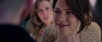 Movie still from “The Town” (2010), directed by Ben Affleck – A woman's face with another woman in the background; Close Up shot, Over the shoulder angle