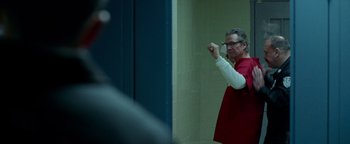 Movie still from “The Town” (2010), directed by Ben Affleck – A man standing in front of a mirror in a room; Medium shot, Over the shoulder angle