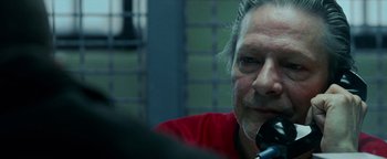 Movie still from “The Town” (2010), directed by Ben Affleck – A person sitting in a room; Close Up shot, Over the shoulder angle