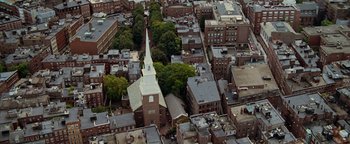 Movie still from “The Town” (2010), directed by Ben Affleck – An aerial view of a church and some buildings; Extreme Wide shot, High angle