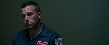 Movie still from “The Town” (2010), directed by Ben Affleck – A person wearing a jacket; Close Up shot, Low angle