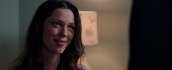 Movie still from “The Town” (2010), directed by Ben Affleck – A woman smiling for the camera; Close Up shot, Over the shoulder angle