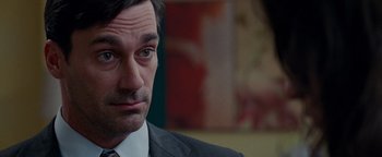 Movie still from “The Town” (2010), directed by Ben Affleck – A man in a suit and tie looking to his left; Close Up shot, Over the shoulder angle