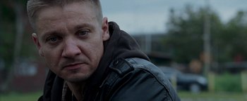 Movie still from “The Town” (2010), directed by Ben Affleck – A person wearing a leather jacket; Close Up shot, Over the shoulder angle