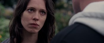 Movie still from “The Town” (2010), directed by Ben Affleck – A person looking at the camera; Close Up shot, Over the shoulder angle
