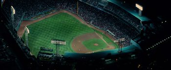 Movie still from “The Town” (2010), directed by Ben Affleck – An aerial view of a baseball field with a lot of fans; Extreme Wide shot, Overhead angle