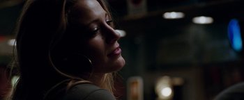 Movie still from “The Town” (2010), directed by Ben Affleck – A person wearing a large hoop earring; Close Up shot, Low angle