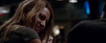 Movie still from “The Town” (2010), directed by Ben Affleck – A person with long brown hair; Close Up shot, Over the shoulder angle