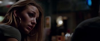 Movie still from “The Town” (2010), directed by Ben Affleck – A person with long blonde hair; Close Up shot, Over the shoulder angle