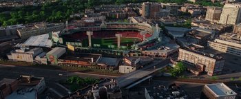 Movie still from “The Town” (2010), directed by Ben Affleck – An aerial view of a baseball stadium with a lot of buildings; Extreme Wide shot, High angle