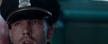 Movie still from “The Town” (2010), directed by Ben Affleck – A person wearing a hat; Close Up shot, Low angle