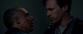 Movie still from “The Town” (2010), directed by Ben Affleck – Two men facing each other in a dark room; Close Up shot, Low angle