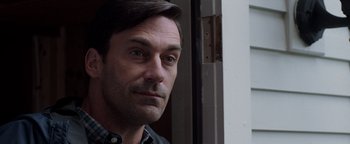 Movie still from “The Town” (2010), directed by Ben Affleck – A person wearing a shirt; Close Up shot, Over the shoulder angle