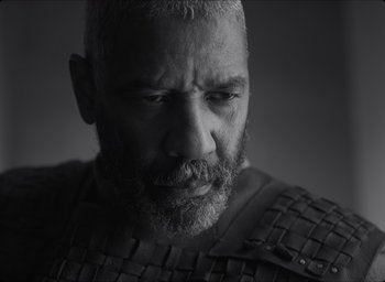 Movie still from “The Tragedy of Macbeth” (2021), directed by Joel Coen – Black and white photograph of a man with a beard; Close Up shot, Low angle