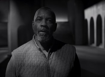 Movie still from “The Tragedy of Macbeth” (2021), directed by Joel Coen – A black and white photo of a man with a beard; Medium shot, Low angle