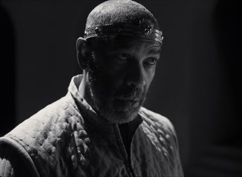 Movie still from “The Tragedy of Macbeth” (2021), directed by Joel Coen – Black and white photograph of a man with a beard; Close Up shot, Low angle