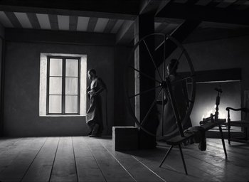 Movie still from “The Tragedy of Macbeth” (2021), directed by Joel Coen – A man standing in a room next to a window; Wide shot, Low angle