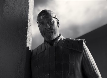 Movie still from “The Tragedy of Macbeth” (2021), directed by Joel Coen – Black and white photograph of a man wearing a helmet; Medium shot, Low angle