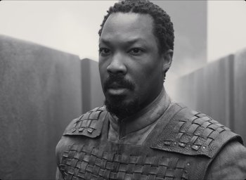 Movie still from “The Tragedy of Macbeth” (2021), directed by Joel Coen – A black and white photo of a man with a beard; Close Up shot, Low angle