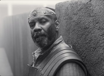 Movie still from “The Tragedy of Macbeth” (2021), directed by Joel Coen – Black and white photograph of a man wearing a helmet; Close Up shot, Low angle