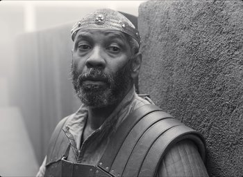 Movie still from “The Tragedy of Macbeth” (2021), directed by Joel Coen – Black and white photograph of a man wearing a helmet; Close Up shot, Low angle