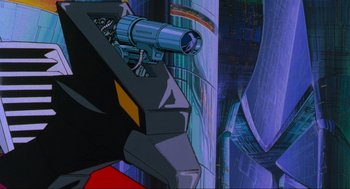 Movie still from “The Transformers: The Movie” (1986), directed by Nelson Shin – A gun on a building; Extreme Close Up shot, Low angle