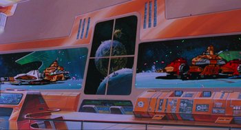Movie still from “The Transformers: The Movie” (1986), directed by Nelson Shin – A painting of a space ship and a space station; Extreme Wide shot, Low angle