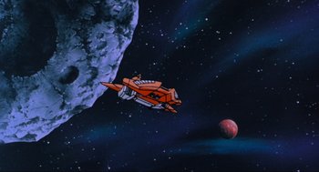 Movie still from “The Transformers: The Movie” (1986), directed by Nelson Shin – An orange spaceship flying over an asteroid in space; Extreme Wide shot, Low angle