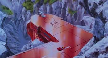 Movie still from “The Transformers: The Movie” (1986), directed by Nelson Shin – A painting of a spaceship in the middle of a mountainous area; Extreme Wide shot, Overhead angle
