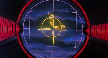 Movie still from “The Transformers: The Movie” (1986), directed by Nelson Shin – A target with a yellow arrow in the center of it; Extreme Wide shot, Low angle