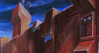 Movie still from “The Transformers: The Movie” (1986), directed by Nelson Shin – An image of a television on the side of a building; Extreme Wide shot, Low angle