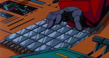 Movie still from “The Transformers: The Movie” (1986), directed by Nelson Shin – An animated hand typing on a computer keyboard; Extreme Close Up shot, High angle