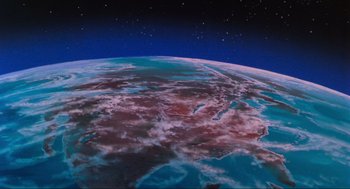 Movie still from “The Transformers: The Movie” (1986), directed by Nelson Shin – A view of the earth from the space shuttle; Extreme Wide shot, Overhead angle