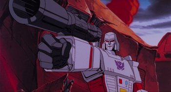 Movie still from “The Transformers: The Movie” (1986), directed by Nelson Shin – Megatron from the transformers cartoon; Medium shot, Low angle