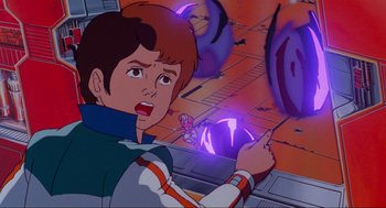 Movie still from “The Transformers: The Movie” (1986), directed by Nelson Shin – A boy is looking at a purple object; Medium shot, Over the shoulder angle