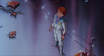 Movie still from “The Transformers: The Movie” (1986), directed by Nelson Shin – A cartoon of a boy in a space suit standing on a platform; Wide shot, High angle