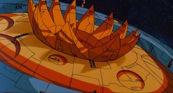 Movie still from “The Transformers: The Movie” (1986), directed by Nelson Shin – View of a board game; Extreme Wide shot, Low angle