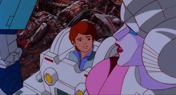 Movie still from “The Transformers: The Movie” (1986), directed by Nelson Shin – A man and a woman are in a spaceship; Close Up shot, Over the shoulder angle