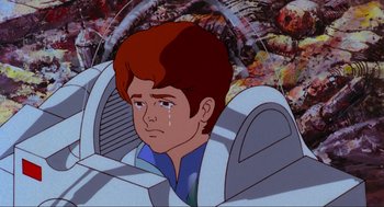 Movie still from “The Transformers: The Movie” (1986), directed by Nelson Shin – A cartoon of a boy crying in a car; Close Up shot, High angle