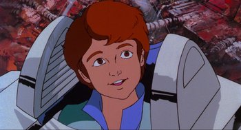 Movie still from “The Transformers: The Movie” (1986), directed by Nelson Shin – A young man's face in a computer screen; Close Up shot, Low angle