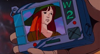 Movie still from “The Transformers: The Movie” (1986), directed by Nelson Shin – A cartoon picture of a woman in a hat; Extreme Close Up shot, Low angle