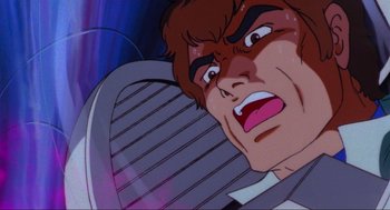 Movie still from “The Transformers: The Movie” (1986), directed by Nelson Shin – A man's face in a cartoon; Extreme Close Up shot, Low angle