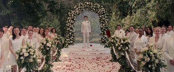 Movie still from “The Twilight Saga: Breaking Dawn - Part 1” (2011), directed by Bill Condon – A man standing in front of a flower covered arch; Wide shot, High angle