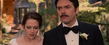 Movie still from “The Twilight Saga: Breaking Dawn - Part 1” (2011), directed by Bill Condon – A man and a woman standing next to each other in front of trees; Close Up shot, Over the shoulder angle