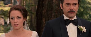 Movie still from “The Twilight Saga: Breaking Dawn - Part 1” (2011), directed by Bill Condon – A man and a woman standing next to each other in front of a tree; Close Up shot, Over the shoulder angle