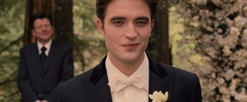 Movie still from “The Twilight Saga: Breaking Dawn - Part 1” (2011), directed by Bill Condon – A person wearing a suit and a bow tie; Close Up shot, Over the shoulder angle